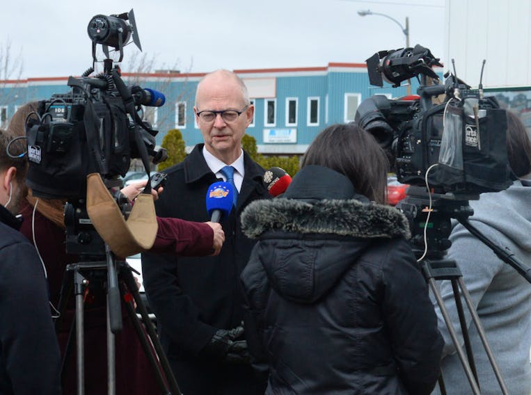 Progressive Conservative Leader Ches Crosbie speaks to reporters Friday outside his campaign headquarters on Austin Street in St. John’s.