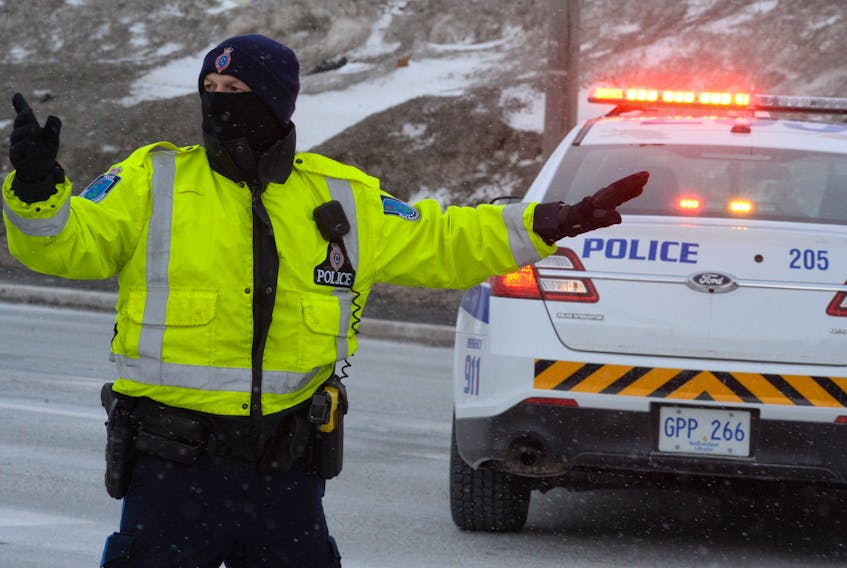 RNC street patrol officer Const. Mike Hollett directs traffic following two-vehicle traffic accident in Paradise on Monday.