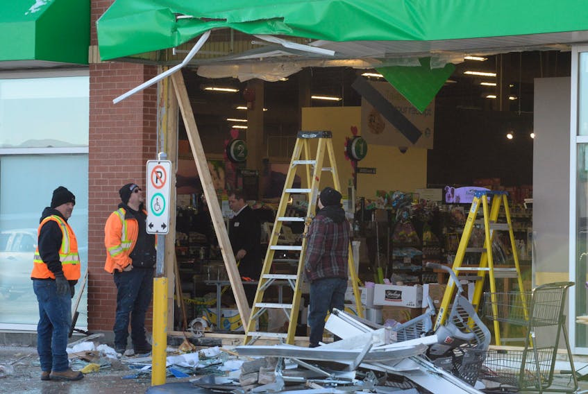Employees of KP Harvey Construction and Sobeys on Kelsey Drive were busy doing repair work Monday morning after an early morning automatic teller machine heist at the supermarket in which a thief, or thieves, used a piece of heavy equipment to break through the front of the store and steal an ATM.