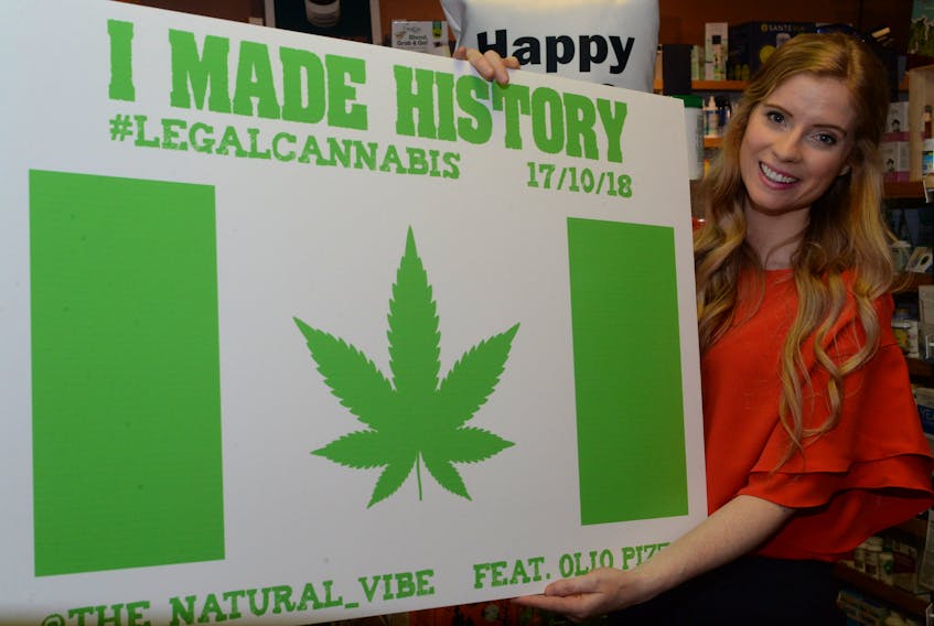 Megan Kennedy, owner/operator of The Natural Vibe retail outlet at 306 Water St. in downtown St. John’s, was busy at work on Tuesday with her staff preparing for today’s legal selling of cannabis as of 12:01 a.m., when it became legal to sell and possess the drug. Kennedy displays a sign at her store on Tuesday afternoon depicting history in the making, when — due to Newfoundland’s time zone — she was set to become one of the first retailers in the country to sell cannabis products.