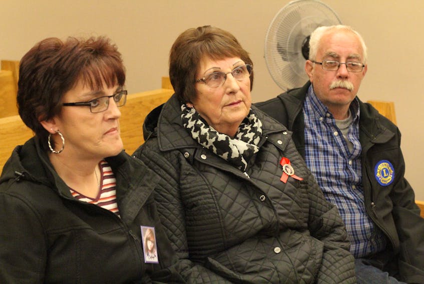 Members of Cortney Lake’s family attend provincial court in St. John’s Tuesday wearing pins with her picture on them. Lake’s mother, Lisa Lake (left), has been trying to obtain a peace bond against Cortney’s ex-boyfriend, Philip Smith. For the second time, Smith wasn’t in court for the scheduled hearing, since sheriff’s officers have been unable to locate him to serve him with a notice to attend.