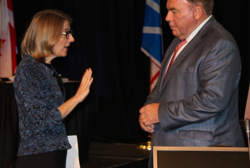 Muskrat Falls Inquiry co-counsel Kate O’Brien tells Nalcor Energy president and CEO Stan Marshall where he can view presentation slides ahead of the start of proceedings at the Lawrence O’Brien Arts Centre in Happy Valley-Goose Bay on Wednesday.