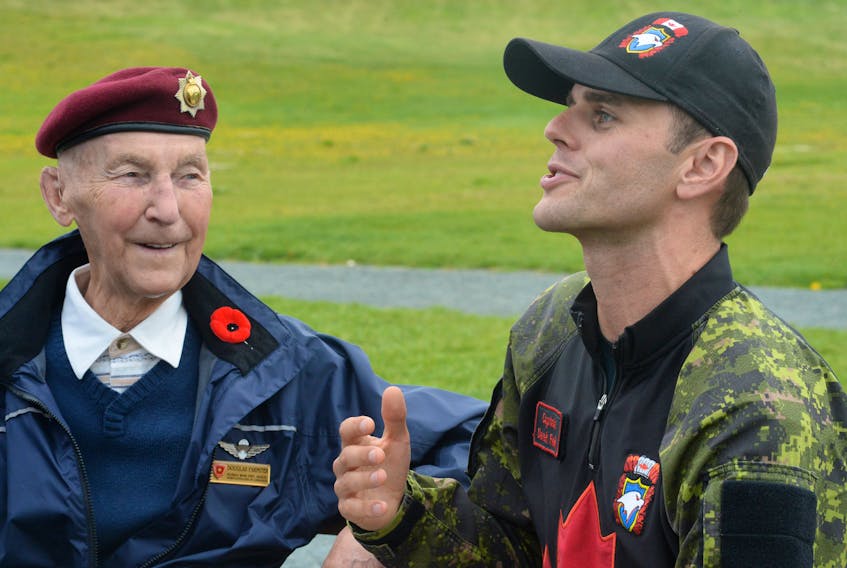 Cpl. Douglas Parmiter, who was a member of the 1st Battalion of the Royal Canadian Regiment and is a Korean War Veteran, chats with Capt. Derek Reid, the public affairs officer for the Canadian Armed Forces parachute demonstration team, the SkyHawks, on Monday afternoon at Paradise Park.