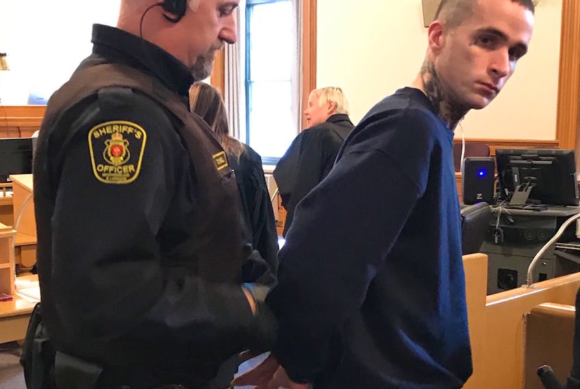 Jason Earle, 25, waits for his trial to begin in Newfoundland and Labrador Supreme Court in St. John's Tuesday morning. Earle is facing a number of charges related to a standoff with police in the west end of the city in September 2016.