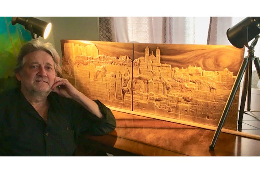 Artist, author and musician Herbert F. Hopkins recently completed “City of Dreams,” a woodcarving depicting the panoramic skyline and cityscape of St. John’s. It took him a year and a half to complete the piece, which is currently for sale.