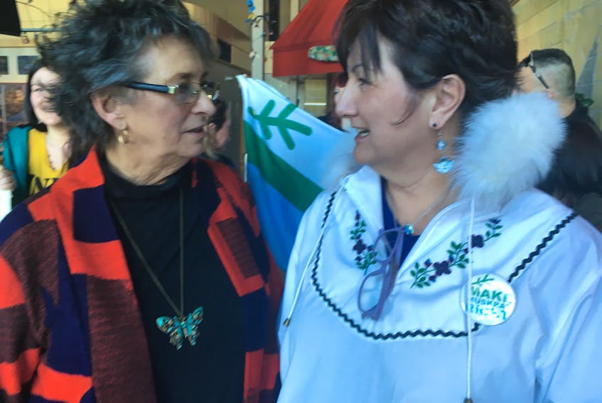 Roberta Benefiel with Grand Riverkeeper Labrador and Marjorie Flowers with the Labrador Land Protectors, along with members of the grassroots organizations, outside of the auditorium at the Lawrence O’Brien Arts Centre in Happy Valley-Goose Bay on Friday.