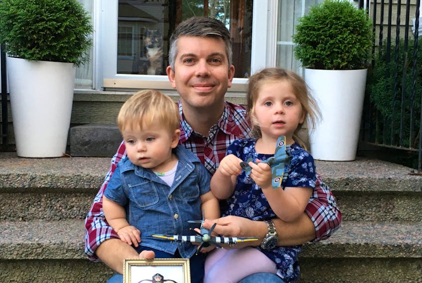 Jarrod Pettipas of Fall River, N.S., sits on the front step of his home with his daughter Kennedy, 2, and son Owen, 1, in addition to holding both model planes, one an exact replica of the Hawker Typhoon plane his grandfather George Martyn flew during the Second World War. The smaller model was one left to Pettipas by his grandfather on his death in 2006 and was refurbished by Joe Gaudon of the IPMS St. John’s Club in 2015. The larger plane is one furnished to Pettipas by Gaudon, an exact replica, including the tail number on his grandfather’s plane.