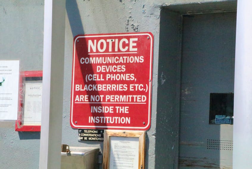 Certain communications devices are not permitted inside prison and must be handed in at security.