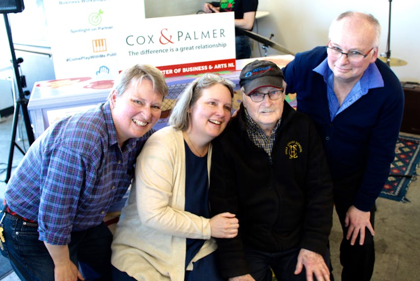 Linda, Laura, Cyril, and Stephen Fitzpatrick pose for photos in front of the province’s newest Business and Arts NL public piano at the St. John’s Farmers’ Market on Freshwater Road.