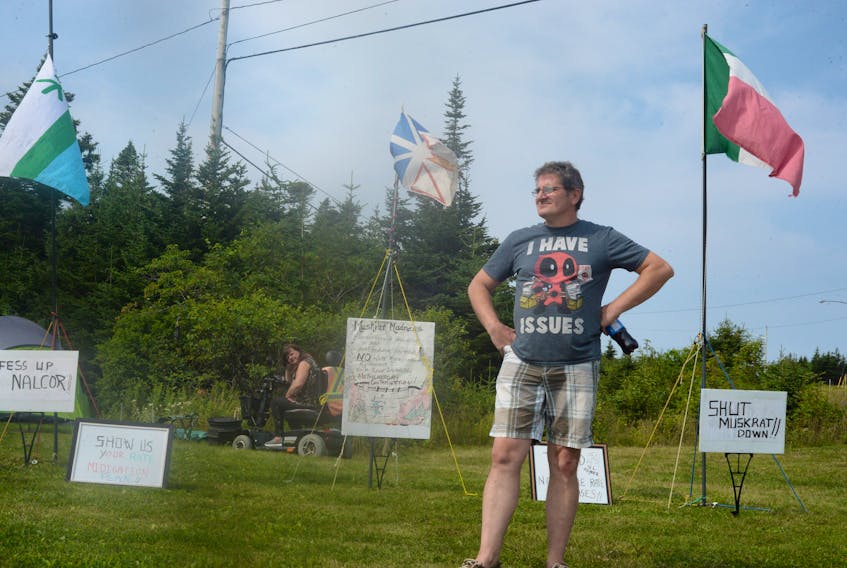 Matthew Valle and his wife, Alicia Della, at their campsite protesting the Muskrat Falls hydroelectric project, Monday on the corner of Captain Whalen Drive and the entrance leading into Nalcor Energy in St. John’s.