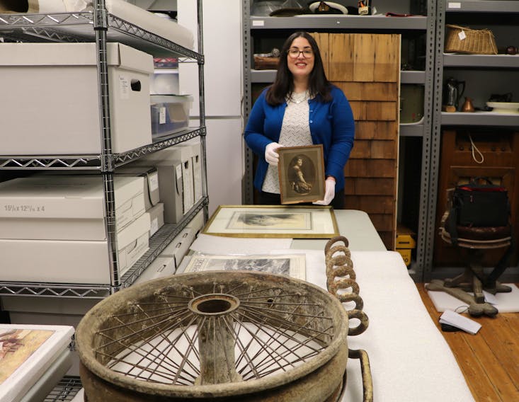 Sarah Wade, manager of the Admiralty House Communications Museum in Mount Pearl, poses with some of the historical artifacts that will be on display for a special exhibit starting May 13 marking the 100th anniversary of the transatlantic air race from Newfoundland to Europe.