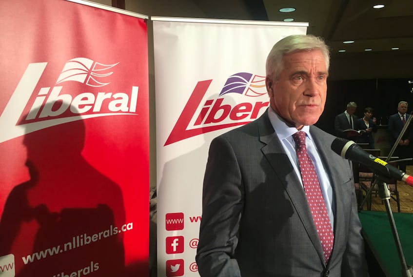 Premier Dwight Ball speaks with reporters at Monday’s platform announcement.