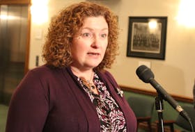 ServiceNL Minister Sherry Gambin-Walsh speaks to reports Thursday at the Confederation Building.
