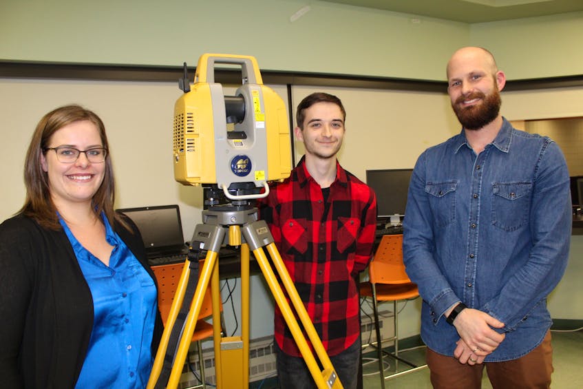 Geomatics students Aimee Snelgrove (left) and Chad Corbett (centre) jumped at the chance to scan a heritage building when their instructor, Blair Bridge, suggested it for their final project.