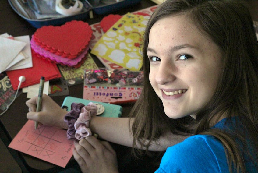 Jenna Pittman, 12, is one of a number of Project Kindness volunteers who have been making valentines to give to those in need of a little love and encouragement.