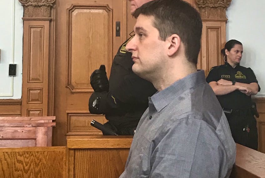 Trent Butt sits in the prisoner's dock in Courtroom No. 1 at Newfoundland and Labrador Supreme Court in St. John's Monday morning, as jury selection began for his murder trial. Butt is charged with first-degree murder and arson in connection with the death of his five-year-old daughter, Quinn Butt, in April 2016.