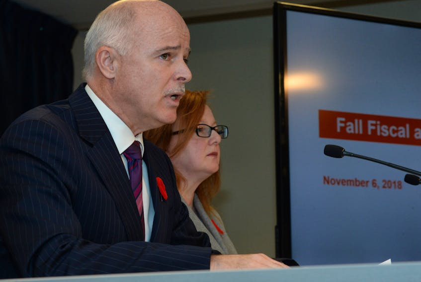 Finance Minister Tom Osborne and deputy minister Denise Hanrahan give the fall fiscal update Tuesday in the media centre at the Confederation Building.