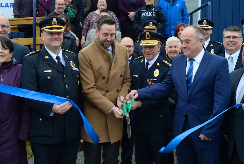 Cutting the ribbon Thursday at the official grand opening of the RNC’s new Conception Bay South detachment in Manuels, C.B.S., are (from left) detachment 0fficer-in-charge Insp. Alex Brennan, Justice Minister Andrew Pardons, RNC Chief of Police Joe Boland and C.B.S. MHA Barry Petten.