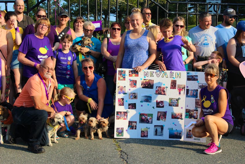 A group of about 120 people gathered in Bowring Park Wednesday evening for a walk with their dogs to remember nine-year-old Nevaeh Denine.