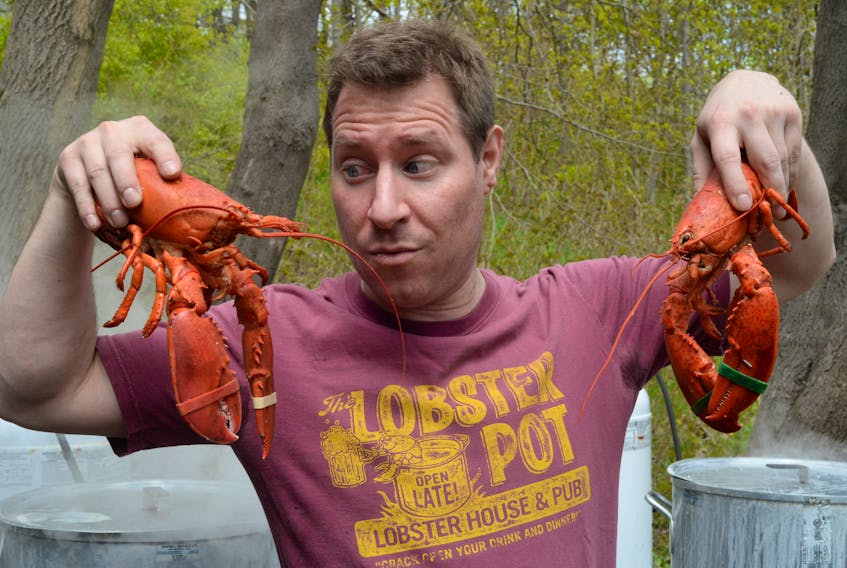 St. Andrew’s Presbyterian Church member Andrew Halliday helps cook crustaceans Wednesday at the church’s 43rd annual lobster dinner fundraiser.