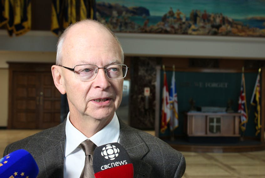 Opposition Leader Ches Crosbie talks to reporters Thursday outside the House of Assembly.