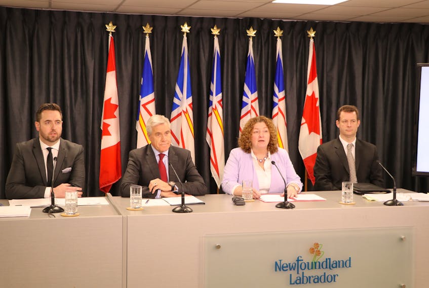 Justice and Public Safety Minster Andrew Parsons, Premier Dwight Ball, Service NL Minister Sherry Gambin-Walsh and Service NL assistant deputy minister Michael Delaney at Monday’s announcement regarding legislative changes to automobile insurance in the province.
