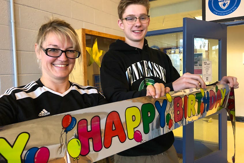 Teacher Amy Slaney-Howell and member of the student council executive Jack Brown were busy Thursday decorating the school lobby for the school’s 60th birthday celebration.