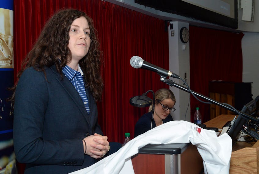 Julia Collins addresses the audience Thursday during the Memorial University school of pharmacy’s Class of 2022 White Coat Ceremony at the Health Sciences Centre.