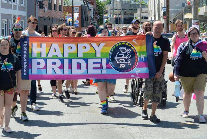 Participants walk in the St. John’s Pride Parade in July 2017.