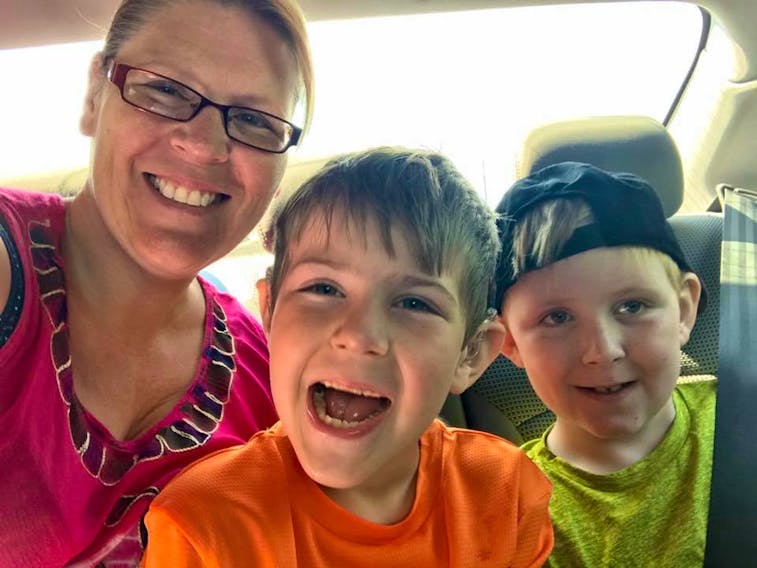 Kimberly Churchill with her sons Carter (centre) and Hunter.