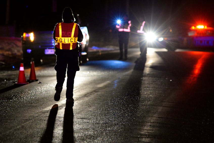 Police monitor the scene of an accident in a file photo. — Keith Gosse
