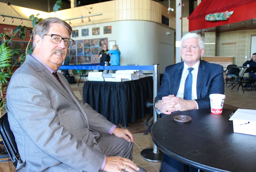 Harold Smith (left) speaks with his client, former Nalcor Energy president and CEO Ed Martin, during a break in the Muskrat Falls Inquiry proceedings Tuesday in Happy Valley-Goose Bay.