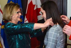 Lt.-Gov. Judy Foote presents the Order of Newfoundland and Labrador to world champion figure skater Kaetlyn Osmond Tuesday at Government House in St. John’s.