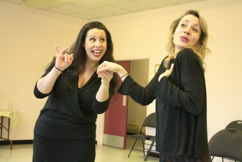 Dana Parsons (left) and Krystin Pellerin rehearse a scene from Atlantic Light Theatre’s production of “Guys and Dolls,” which opens Thursday night at the St. John’s Arts and Culture Centre and runs until Saturday.