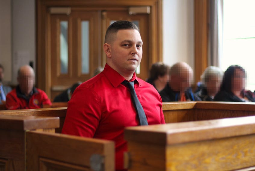 Accused murderer Craig Pope sits in the dock in Courtroom No. 1 at Newfoundland and Labrador Supreme Court in St. John's Monday morning as the jury is chosen for his trial, which is set to start today (faces of potential jurors obscured by The Telegram).