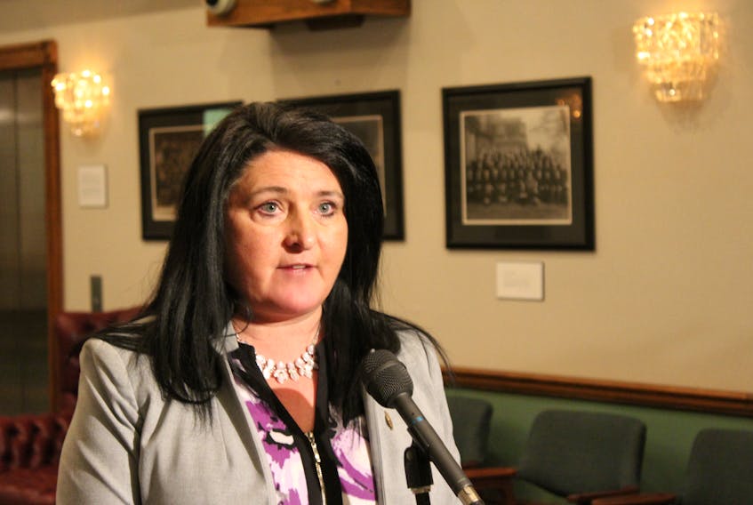 Minister Responsible for the Status of Women Carol Anne Haley speaks to reporters Monday.