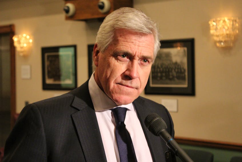 Premier Dwight Ball speaks to reporters Monday.