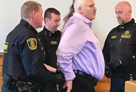 Sheriffs prepare to escort Allan Potter back to the lockup after court in St. John's Tuesday afternoon. After a day-long delay that saw sheriff's officer plucking people off Water Street and handing them a summons for jury duty, Potter's murder trial is set to begin Wednesday morning.