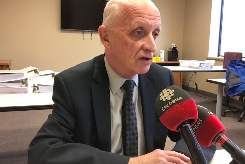 Consumer Advocate Dennis Browne speaks to reporters Friday following the final public hearing for the Muskrat Falls Inquiry before a planned Easter break.