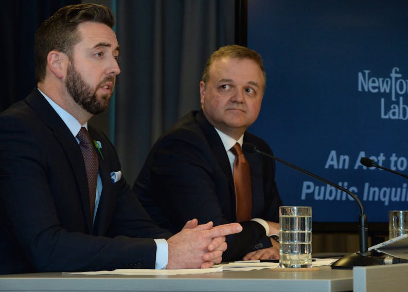 Justice Minister Andrew Parsons (left) and deputy justice minister Todd Stanley speak about proposed amendments to the Public Inquiries Act at the Confederation Building on Tuesday afternoon.