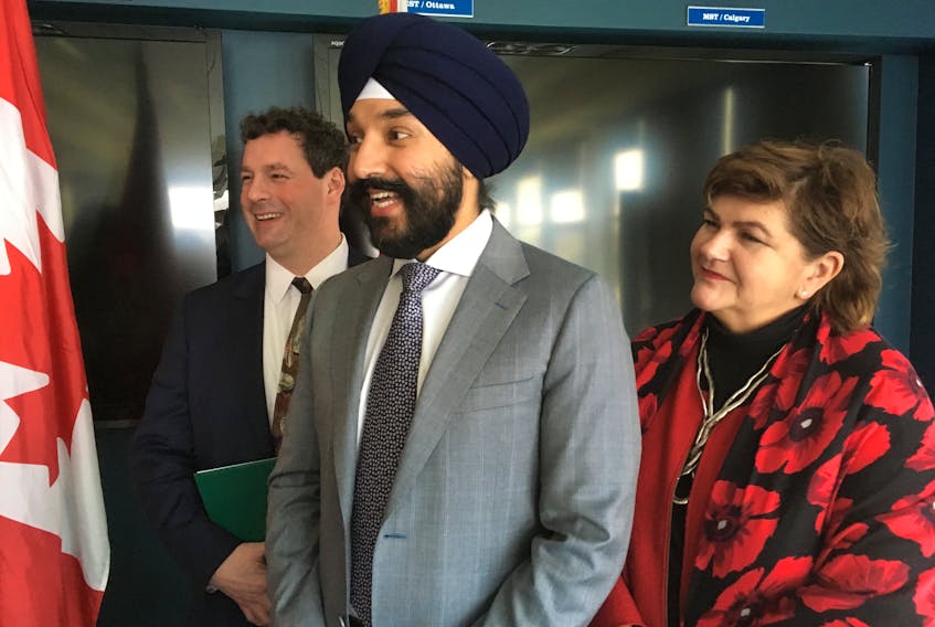 St. John’s East MP Nick Whalen (left), Long Range Mountains MP Gudie Hutchings (right) and Minister of Innovation, Science and Economic Development Navdeep Bains take questions about Budget 2018 following an event at C-CORE at Memorial University of Newfoundland’s St. John’s campus on Tuesday.