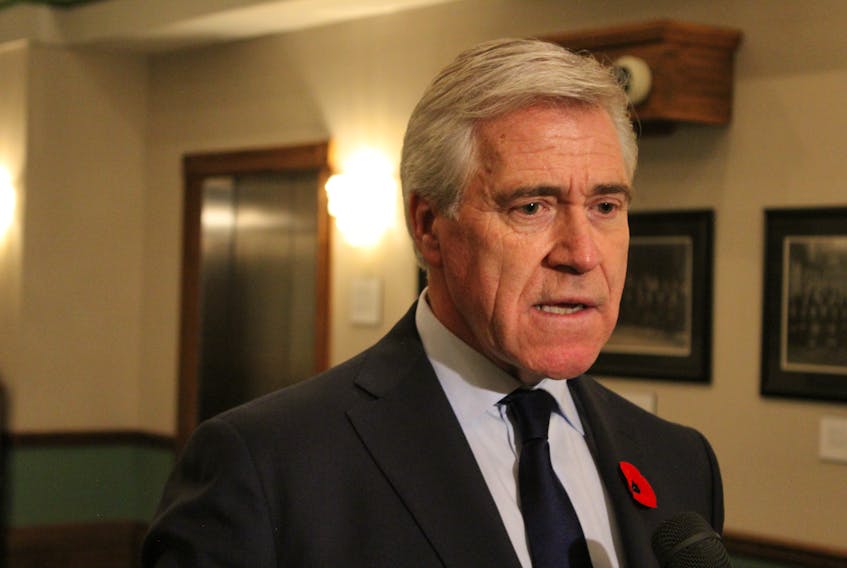 Premier Dwight Ball speaks to reporters Wednesday at the House of Assembly.