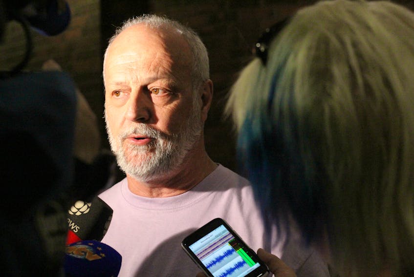 Bruce Harvey speaks to reporters Friday in St. John's after his late niece’s ex-husband, Ray Newman, was found guilty of assaulting a woman last September.