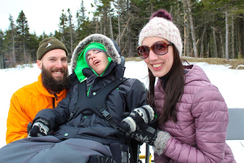 These people were enjoying a campfire outside the Easter Seals House on Mt. Scio Road. From left: Andrew Boland, Brennan Gates, 14, and Julie Brocklehurst.