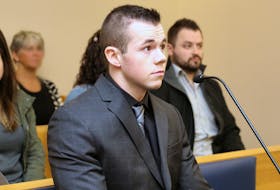 Alex Seymour, 24, waits for his sentencing hearing to begin in provincial court in St. John’s Thursday morning.