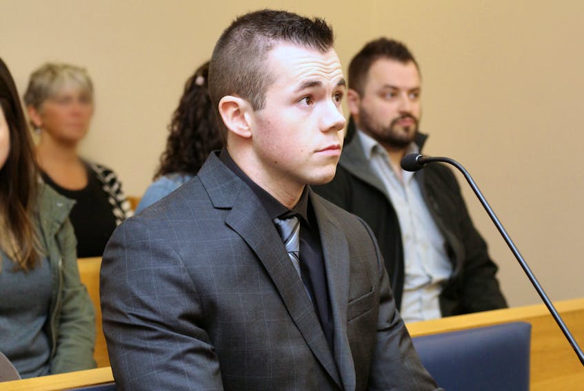Alex Seymour, 24, waits for his sentencing hearing to begin in provincial court in St. John’s Thursday morning.