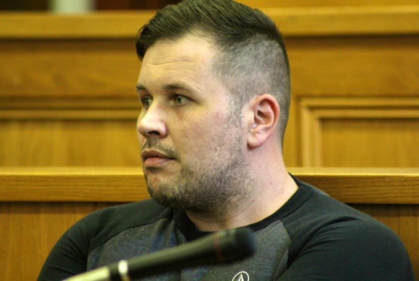 Paul Bernard Maher, 36, sits in the dock in Newfoundland and Labrador Supreme Court in St. John’s Friday afternoon, waiting to learn his sentence for a vicious attack on his girlfriend last fall, witnessed by her young daughter.
