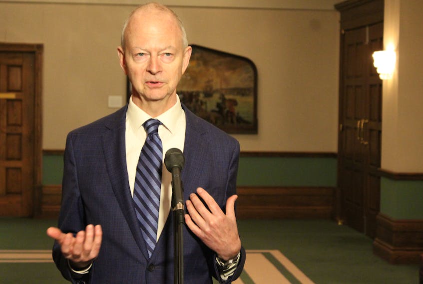Progressive Conservative Leader Ches Crosbie speaks to reporters Tuesday outside the House of Assembly.