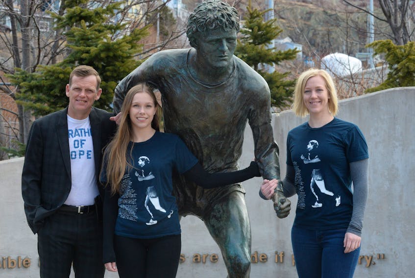 Darrell Fox, younger brother of Terry Fox, his daughter Alexandra (left) and his niece Kirsten Fox stand at the Terry Fox monument in downtown St. John’s on Friday. They represented the Fox family at an event announcing a new national network for cancer research, led by the Terry Fox Research Institute.