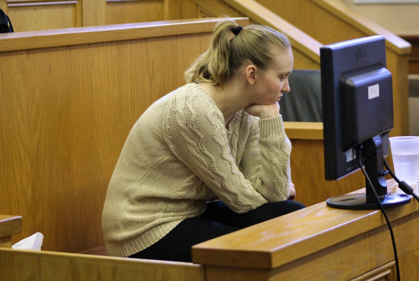 Anne Norris, 30, sits in the courtroom at the start of afternoon proceedings in her murder trial in Newfoundland and Labrador Supreme Court in St. John’s Tuesday afternoon.